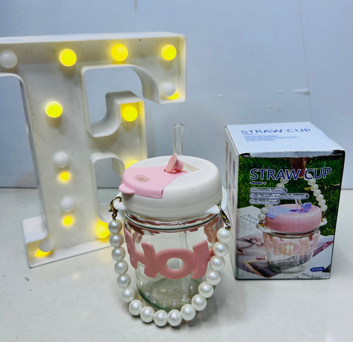 Pearl handle glass bottle with straw