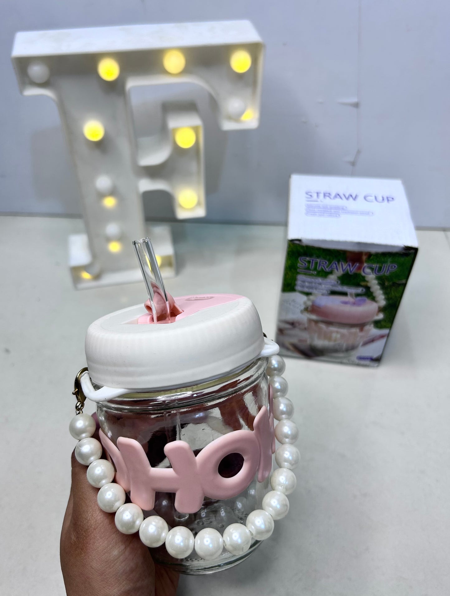 Pearl handle glass bottle with straw